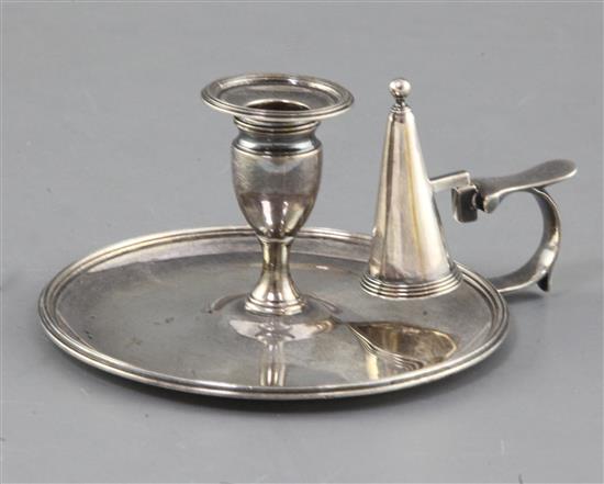 A George III silver reeded circular chamberstick and matching extinguisher by John Edwards, 10.2cm.